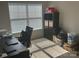 Bedroom with a window with blinds, a desk and chair, and storage shelves against the wall at 15005 Savannah Hall Dr # 72, Charlotte, NC 28273