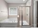 Bathroom featuring a shower stall and separate soaking tub by a window at 159 Autumn Mist Rd, Statesville, NC 28677