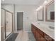 Bathroom with double sink vanity, a tile shower, and a door to a toilet room at 159 Autumn Mist Rd, Statesville, NC 28677