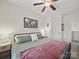 Bright bedroom with ample natural light, ceiling fan, and tasteful decor creates a welcoming atmosphere at 159 Autumn Mist Rd, Statesville, NC 28677