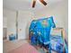 Bright bedroom featuring a ceiling fan and a ' bunk bed with an ocean themed covering at 159 Autumn Mist Rd, Statesville, NC 28677