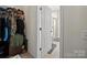 Walk-in closet featuring ample storage space and a view into an ensuite bathroom with shower at 159 Autumn Mist Rd, Statesville, NC 28677