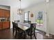 Elegant dining room with a wooden table, stylish chairs, and modern lighting at 159 Autumn Mist Rd, Statesville, NC 28677