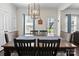 Elegant dining room with a wooden table, stylish chairs, and modern lighting at 159 Autumn Mist Rd, Statesville, NC 28677
