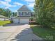 Two-story home with a spacious three-car garage and well-maintained front yard at 159 Autumn Mist Rd, Statesville, NC 28677