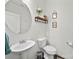 Modern half bathroom featuring a pedestal sink and decorative accents at 159 Autumn Mist Rd, Statesville, NC 28677