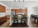 Spacious kitchen with granite island, breakfast bar, stainless appliances, and a convenient bench with storage at 159 Autumn Mist Rd, Statesville, NC 28677