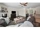 Spacious living room featuring a fireplace, plush sofa, and hardwood floors at 159 Autumn Mist Rd, Statesville, NC 28677
