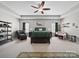 Spacious main bedroom with tray ceiling, ceiling fan, stylish decor, and ample natural light at 159 Autumn Mist Rd, Statesville, NC 28677
