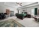 Spacious main bedroom with tray ceiling, ceiling fan, stylish decor, and ample natural light at 159 Autumn Mist Rd, Statesville, NC 28677