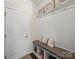 Well-organized mud room with bench seating, storage cubbies, and decorative wall hooks for a functional space at 159 Autumn Mist Rd, Statesville, NC 28677