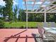 View of outdoor patio with pergola and outdoor dining set; lush green lawn for relaxation and entertainment at 159 Autumn Mist Rd, Statesville, NC 28677