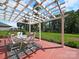 Covered patio area featuring dining set and swing for relaxation and enjoying outdoor living at 159 Autumn Mist Rd, Statesville, NC 28677