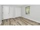 A bright bedroom features light-colored walls, a window with blinds, and two large closets at 16509 Kimbolten Dr, Huntersville, NC 28078