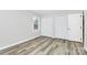 Bedroom featuring hardwood floors, natural light, and a closet at 16509 Kimbolten Dr, Huntersville, NC 28078