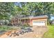 Charming brick home with a two-car garage and a well-maintained front yard at 16509 Kimbolten Dr, Huntersville, NC 28078