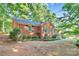 Charming brick home with dark shutters and lush greenery at 16509 Kimbolten Dr, Huntersville, NC 28078