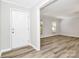 Foyer with a white front door and hardwood style floors at 16509 Kimbolten Dr, Huntersville, NC 28078