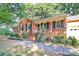 Lovely brick home with a cozy front porch and landscaped garden at 16509 Kimbolten Dr, Huntersville, NC 28078
