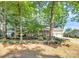 Traditional brick home with attached garage and well-manicured landscaping at 16509 Kimbolten Dr, Huntersville, NC 28078