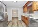 Updated kitchen featuring stainless steel appliances, wood cabinets, and sleek countertops at 16509 Kimbolten Dr, Huntersville, NC 28078