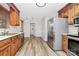 A bright kitchen with wood cabinets, stainless steel appliances and adjacent dining area at 16509 Kimbolten Dr, Huntersville, NC 28078