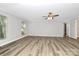 Spacious and bright living room features a neutral color palette and luxury vinyl plank flooring at 16509 Kimbolten Dr, Huntersville, NC 28078