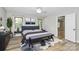 Cozy main bedroom with a comfortable bed and ample natural light from two windows at 16509 Kimbolten Dr, Huntersville, NC 28078