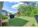 This backyard includes a playset, black grill, and plenty of green space at 1736 Rhynes Trl, Rock Hill, SC 29732