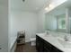 Bright bathroom with dual vanity sinks, soaking tub, wood floors, and storage rack at 1736 Rhynes Trl, Rock Hill, SC 29732