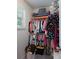 This closet has clothes hanging on racks, storage bins, and a basket at 1736 Rhynes Trl, Rock Hill, SC 29732