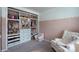 This organized walk-in closet includes custom shelves, drawers, and clothing racks at 1736 Rhynes Trl, Rock Hill, SC 29732