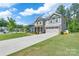 Beautiful two-story home with a well-maintained lawn, concrete driveway, attached garage, and a welcoming facade at 1736 Rhynes Trl, Rock Hill, SC 29732