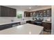 Modern kitchen with a farmhouse sink, stainless steel appliances, and ample counter space at 1736 Rhynes Trl, Rock Hill, SC 29732