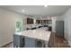 Modern kitchen featuring a large island with seating and stainless steel appliances at 1736 Rhynes Trl, Rock Hill, SC 29732