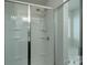 Bright shower with glass door, shelving, and rainfall shower head at 1736 Rhynes Trl, Rock Hill, SC 29732