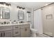 Modern bathroom boasts double sinks, granite countertops, and a sleek, glass-enclosed shower at 201 Valley St, Stanley, NC 28164