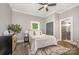 Cozy bedroom with ceiling fan, natural light, and attached bathroom at 201 Valley St, Stanley, NC 28164