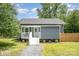 Charming home with a welcoming porch, well-manicured lawn, and a freshly painted exterior at 201 Valley St, Stanley, NC 28164