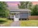 Charming home with freshly landscaped front yard, inviting entry and new walkway at 201 Valley St, Stanley, NC 28164