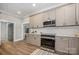 Spacious kitchen with stainless steel appliances, granite counters, and ample cabinet space at 201 Valley St, Stanley, NC 28164