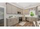 Beautiful kitchen with stainless steel appliances, white subway tile backsplash and hardwood floors at 201 Valley St, Stanley, NC 28164