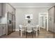 Open kitchen featuring stainless steel refrigerator and a table for dining at 201 Valley St, Stanley, NC 28164