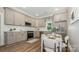Beautiful kitchen with stainless steel appliances, white subway tile backsplash and breakfast nook at 201 Valley St, Stanley, NC 28164