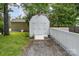 White shed with red roof and double doors at the end of a gravel drive at 201 Valley St, Stanley, NC 28164