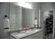 Bathroom with granite countertops, double sinks, and access to a walk-in closet for convenience at 205 Spring Creek Dr, Mount Holly, NC 28120