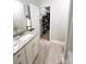 Bathroom view features a sink with granite countertops and an open door to a walk-in closet at 205 Spring Creek Dr, Mount Holly, NC 28120