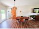 Cozy dining room features a wooden table and chairs, a sliding barn door, and stylish lighting at 205 Spring Creek Dr, Mount Holly, NC 28120