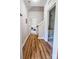Bright hallway with durable flooring leads to bedrooms and storage space, offering practicality and style at 205 Spring Creek Dr, Mount Holly, NC 28120