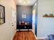 Inviting hallway with stylish decor and hardwood floors welcomes you inside the home at 205 Spring Creek Dr, Mount Holly, NC 28120